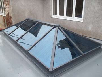 MR & MRS H HOYLAKE - HWL THERMALLY BROKEN ROOF LIGHT GLAZED WITH CELCIUS ONE GLASS RAL 7012. aluminium roof lantern on Wirral. High Quality - architecturally design - Aluminium lantern light near Caldy CH4 8QX - near West Kirby CH4 8QX - Near Heswall - Near Formby - Near Crosby - Near Liverpool Our Aluminium Powder coated roof lanterns can be found in any RAL colour in either 28mm argon filed double glazing or 44mm argon filed triple glazing. Our Aluminium Roof lanterns can be found on the Wirral in either West Kirby CH48, and Aluminium roof lanterns in Caldy CH48. Aluminium Roof lanterns can also be found in Liverpool in Formby, Crosby, Southport, Nearer to Manchester you can find our Aluminium Roof lanterns in Wilmslow, Alderly Edge and Nutsford. We have installed aluminium roof lanterns in Prestbury near Wilmslow. Aluminium Bi-fold doors have been largely demanded in Tarpoley.